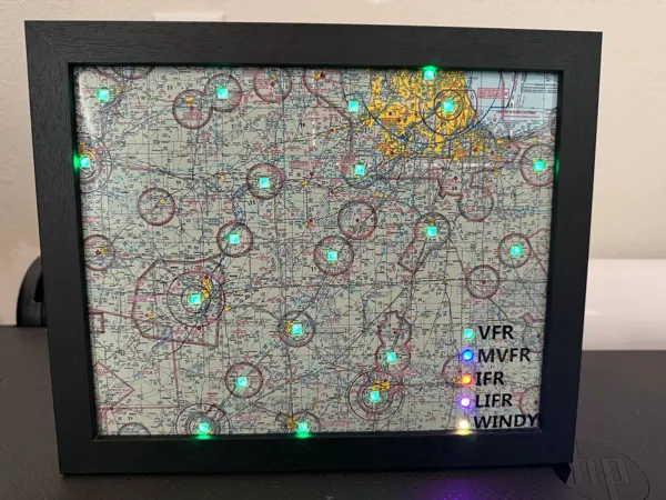 A framed sectional map with green lights and a lit legend for VFR, MVFR, IFR, LIFR and Windy