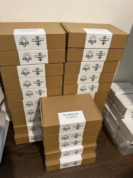 Boxed DIY METAR kits stacked and ready to ship