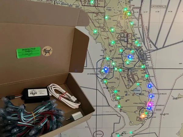 An unboxed kit: the hub, the lights and a printed Florida map